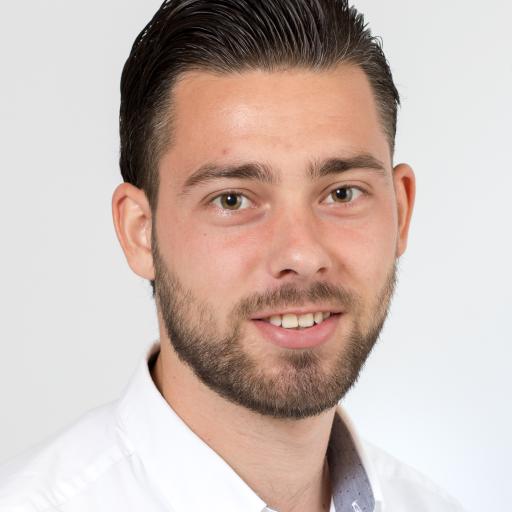 Vincent Bakker, headshot, wearing a white shirt, smiling towards the camera