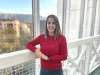 Anna-Lena Nadler smiling in front of a balcony